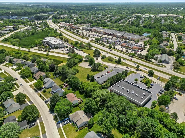 an aerial view of residential houses with outdoor space