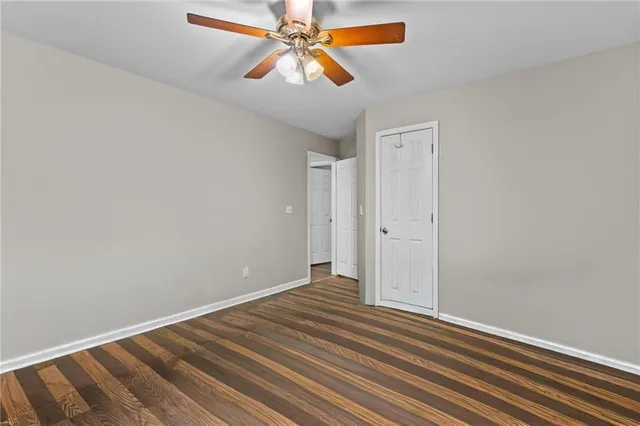 a view of room with window and ceiling fan