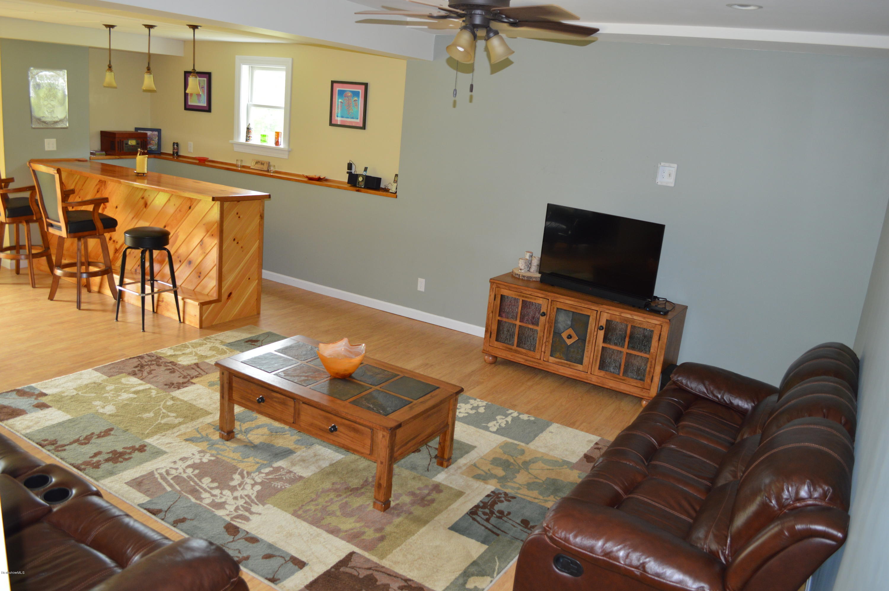 41 South Road Ext Road Peru, MA 01235 - Photo 14 of 55 a living room with furniture and a flat screen tv