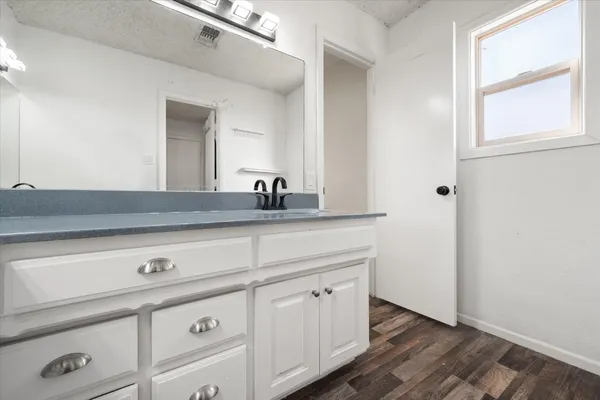 a close view of a faucet sink and mirror