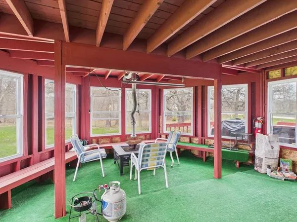 an aerial view of residential house with outdoor space and trees