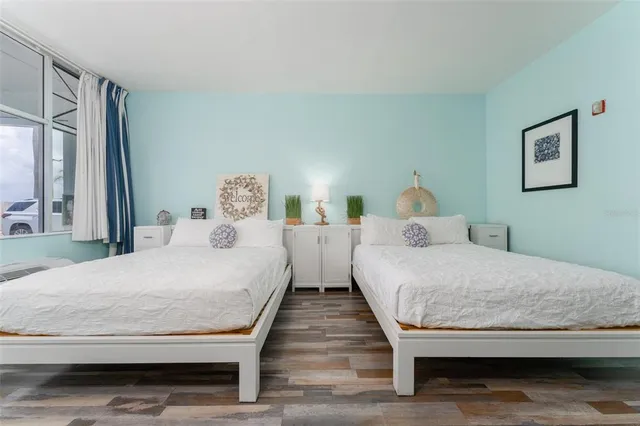 a bedroom with bed and window