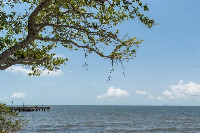 a car parked in front of a building next to a road
