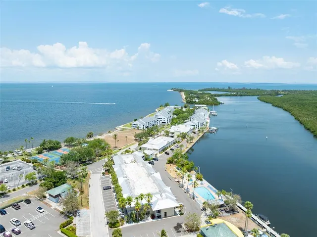 a view of swimming pool with a house in the background