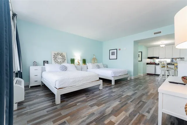 a bedroom with a bed and a table