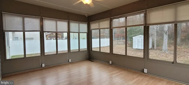 a view of an empty room with a large window