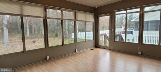 a view of an empty room with a large window
