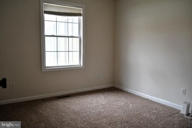 a bathroom with a sink toilet and mirror