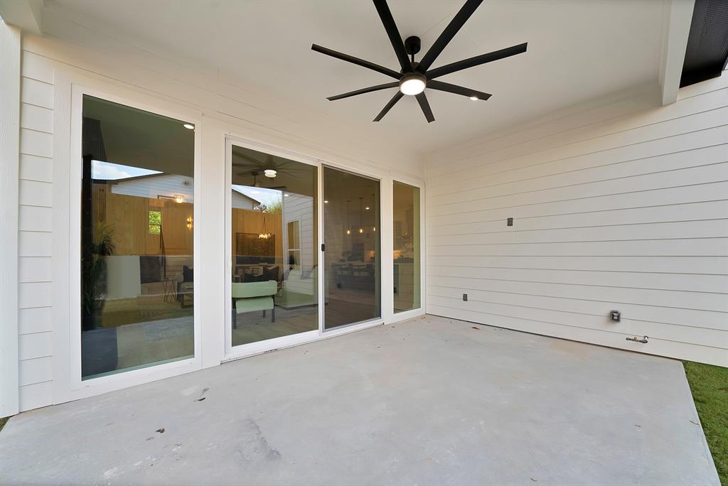 1415 Fayette Street Dallas, TX 75203 - Photo 38 of 40 Covered patio with concrete flooring, shiplap siding, and a modern ceiling fan with integrated lighting