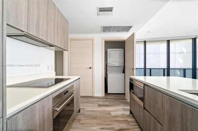 a view of bathroom with washer and dryer