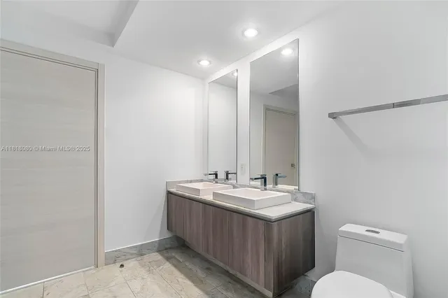 a bathroom with a sink and shower