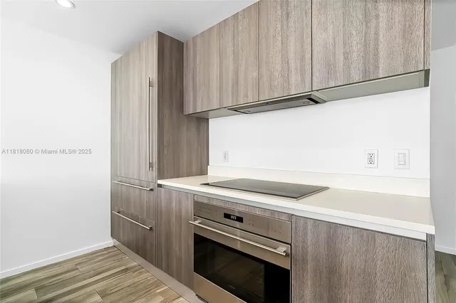 a kitchen that has a sink and a stove