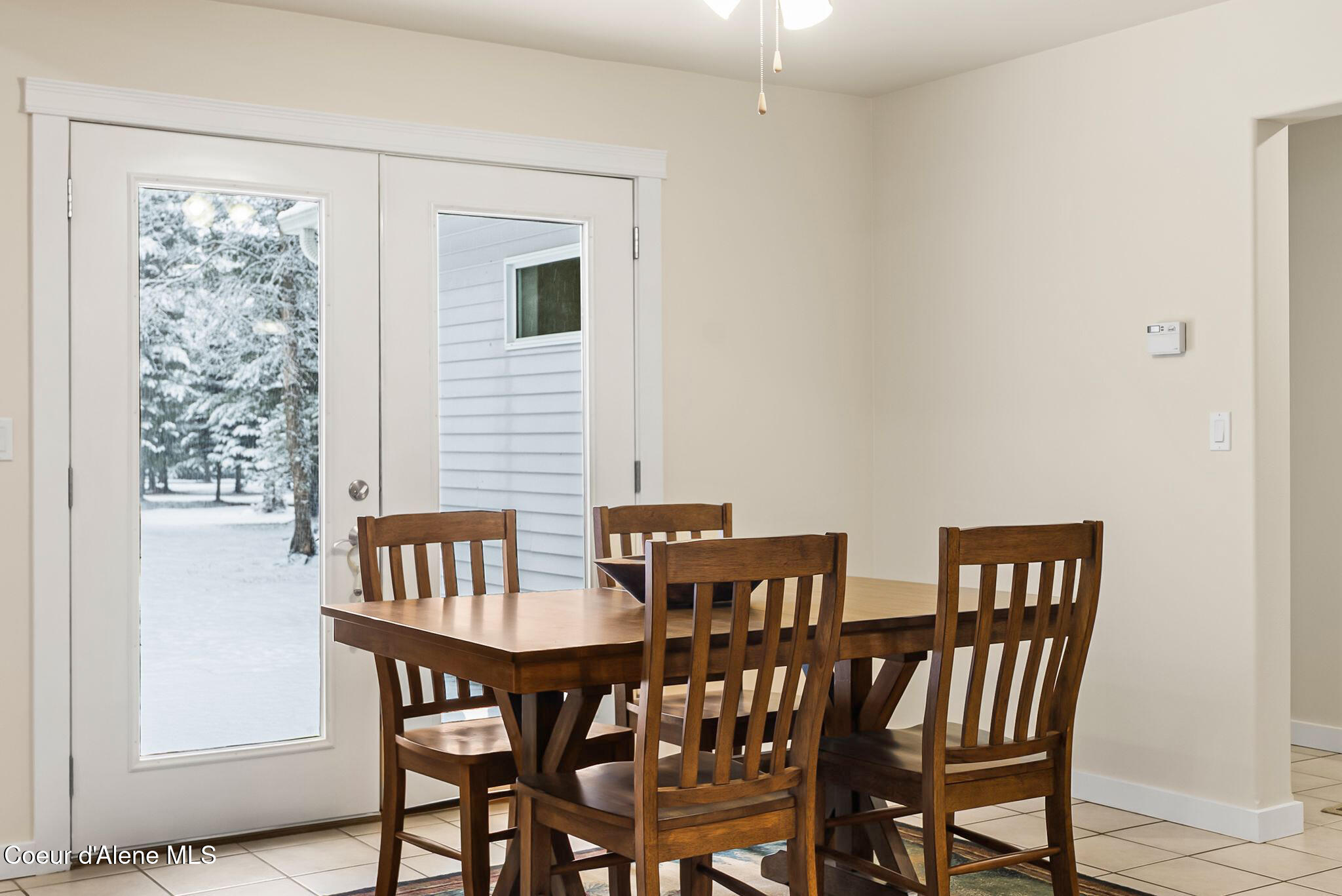 249 Indigo Sky Road Sandpoint, ID 83864 - Photo 30 of 71 Dining room with deck access