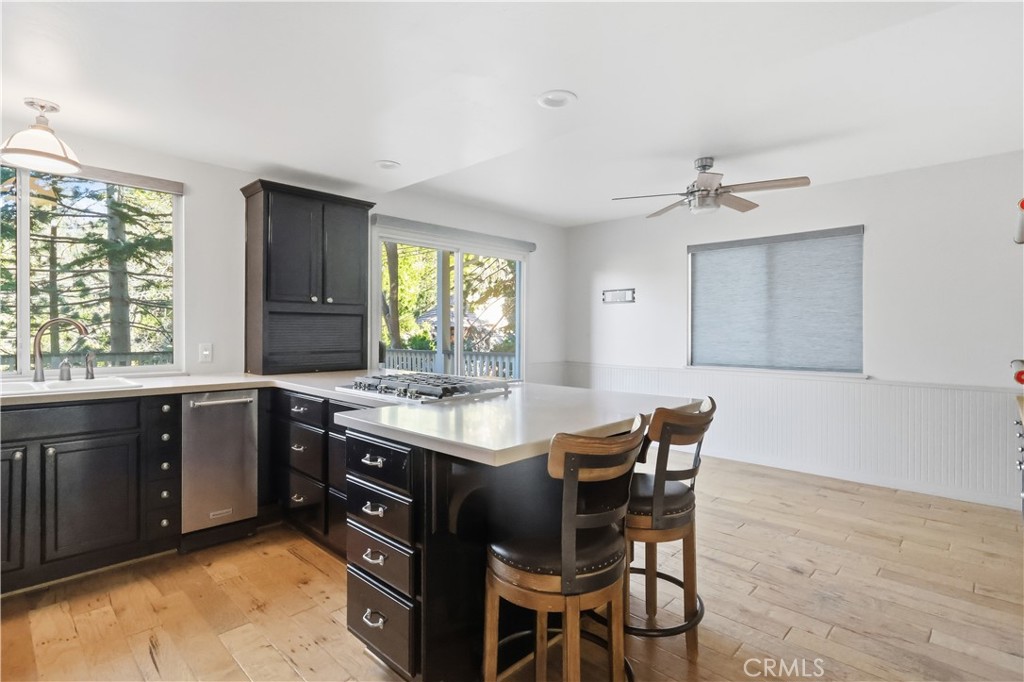 174 Golf Course Road Lake Arrowhead, CA 92391 - Photo 11 of 71 a kitchen with a sink and chairs