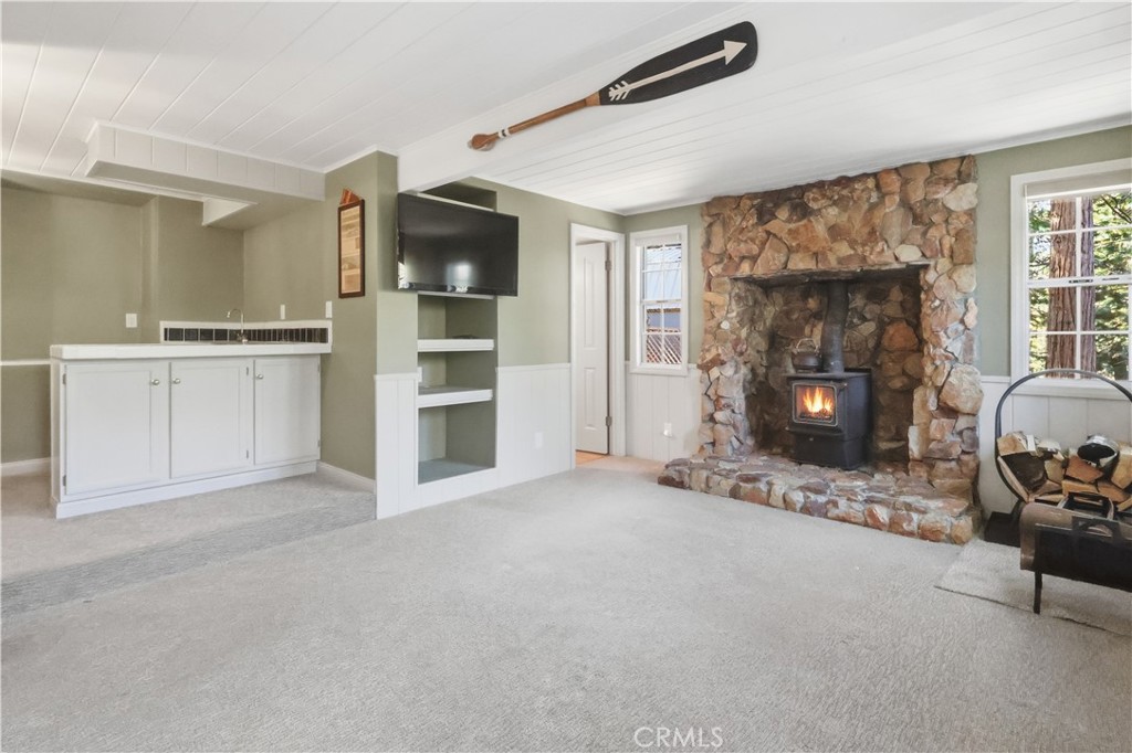 174 Golf Course Road Lake Arrowhead, CA 92391 - Photo 18 of 71 a view of a livingroom with furniture and a fireplace