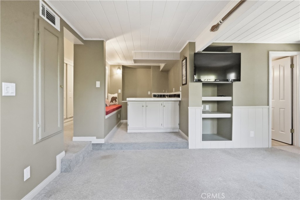 174 Golf Course Road Lake Arrowhead, CA 92391 - Photo 19 of 71 a view of a kitchen with a sink and dishwasher cabinets
