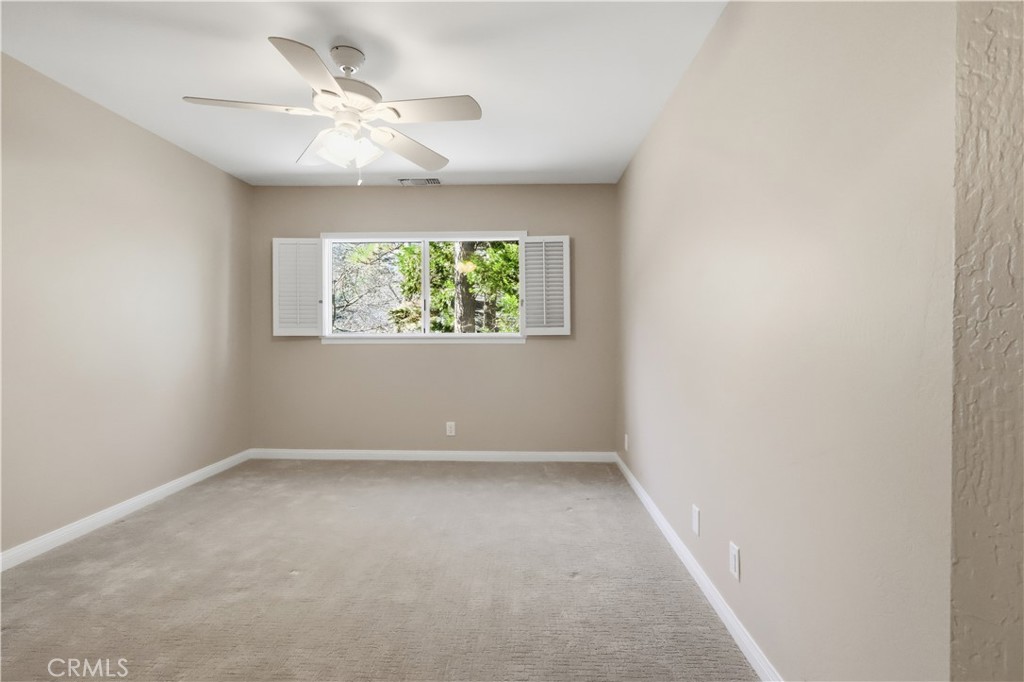 174 Golf Course Road Lake Arrowhead, CA 92391 - Photo 34 of 71 an empty room with windows and fan