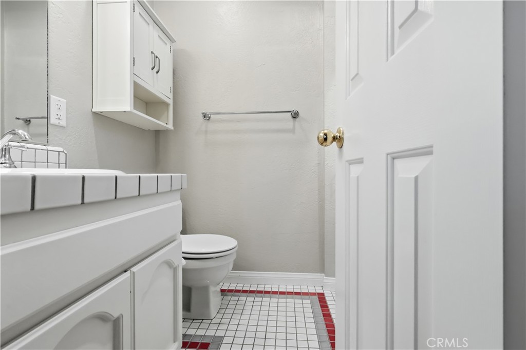 174 Golf Course Road Lake Arrowhead, CA 92391 - Photo 40 of 71 a bathroom with a sink a toilet and shower