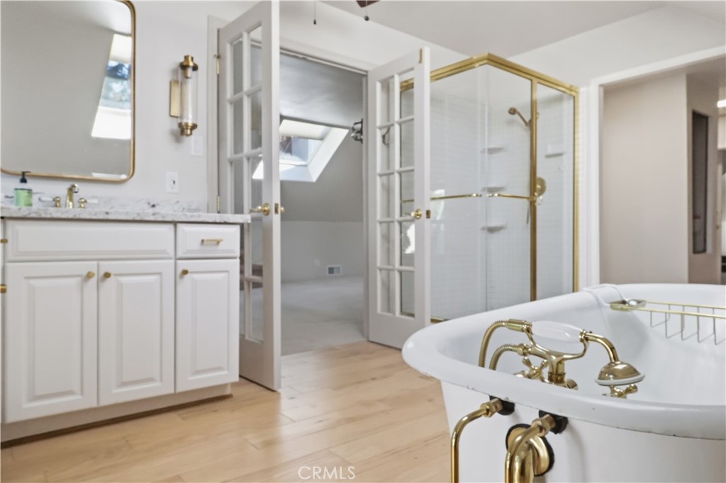 174 Golf Course Road Lake Arrowhead, CA 92391 - Photo 50 of 71 a bathroom with a granite countertop sink and a mirror