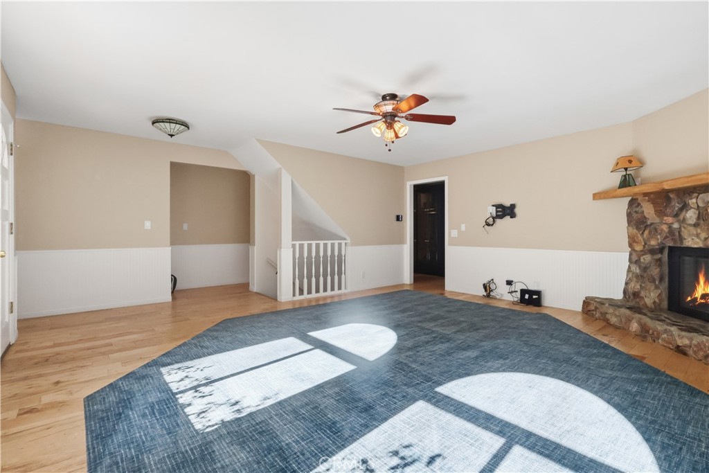 174 Golf Course Road Lake Arrowhead, CA 92391 - Photo 5 of 71 a view of a livingroom with a fireplace and workspace
