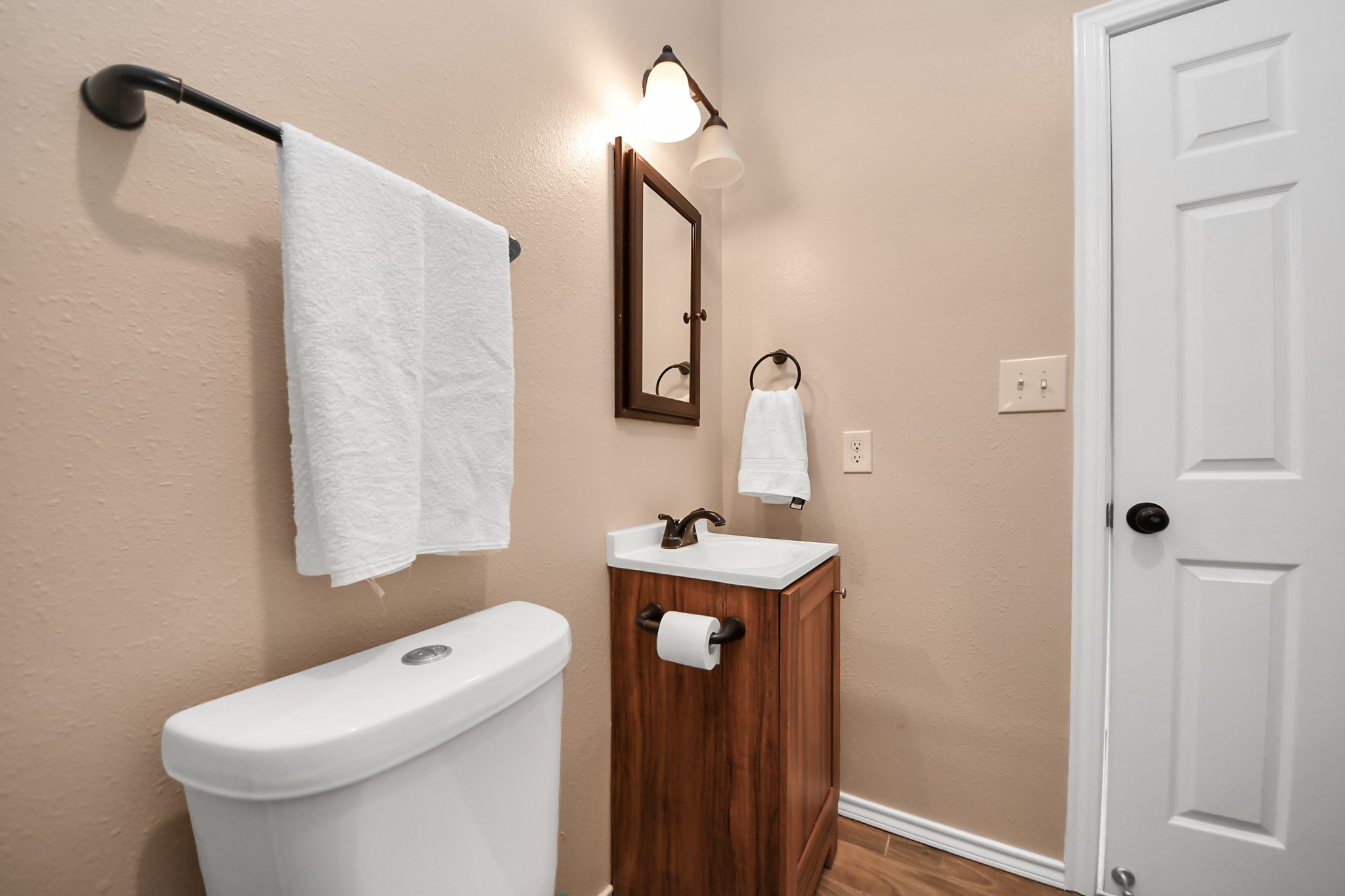 14961 Lamar Road Willis, TX 77378 - Photo 21 of 31 Convenient powder room with sleek finishes.