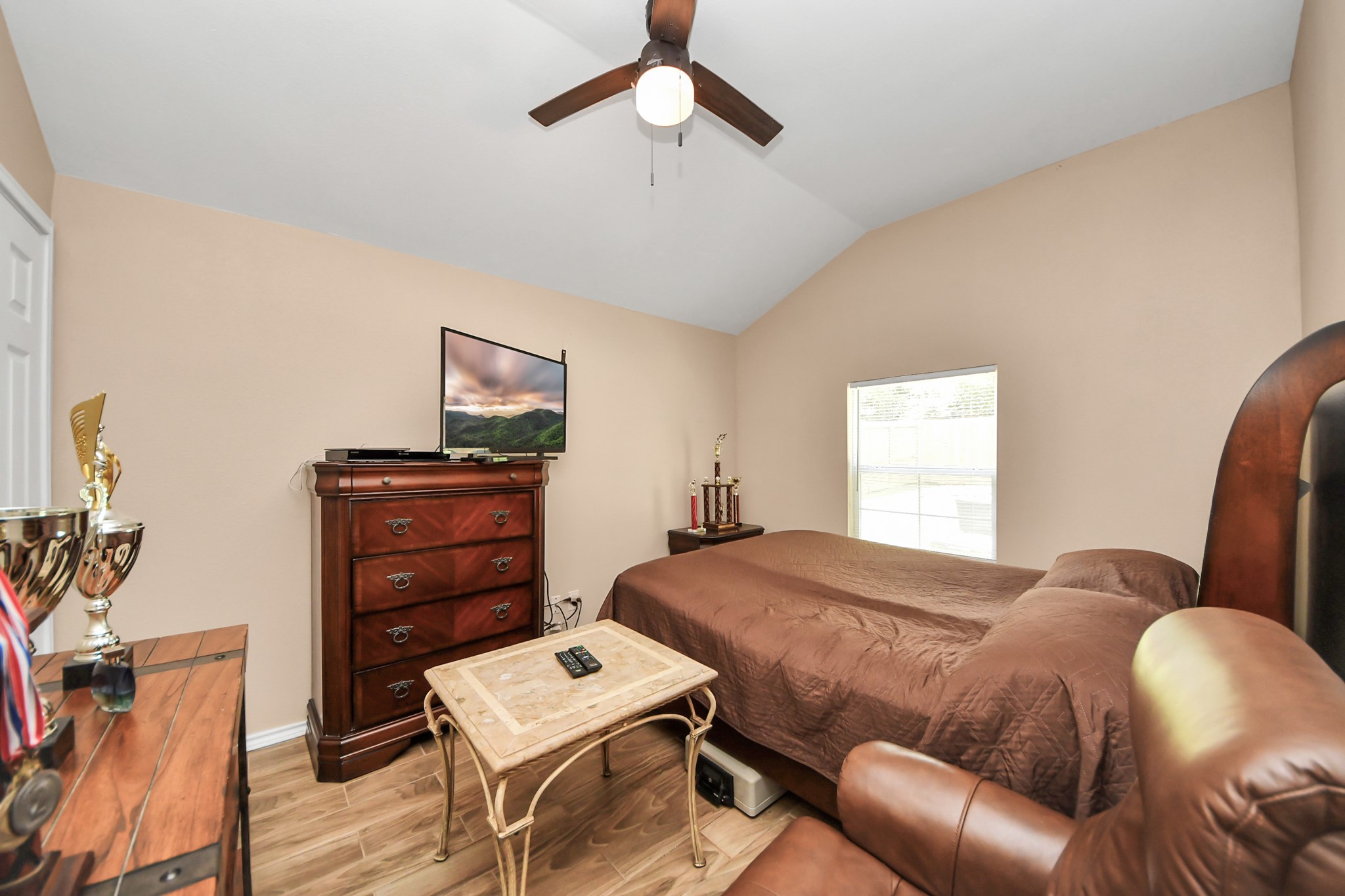 14961 Lamar Road Willis, TX 77378 - Photo 23 of 31 Bright and inviting secondary bedroom with an open, airy feel.