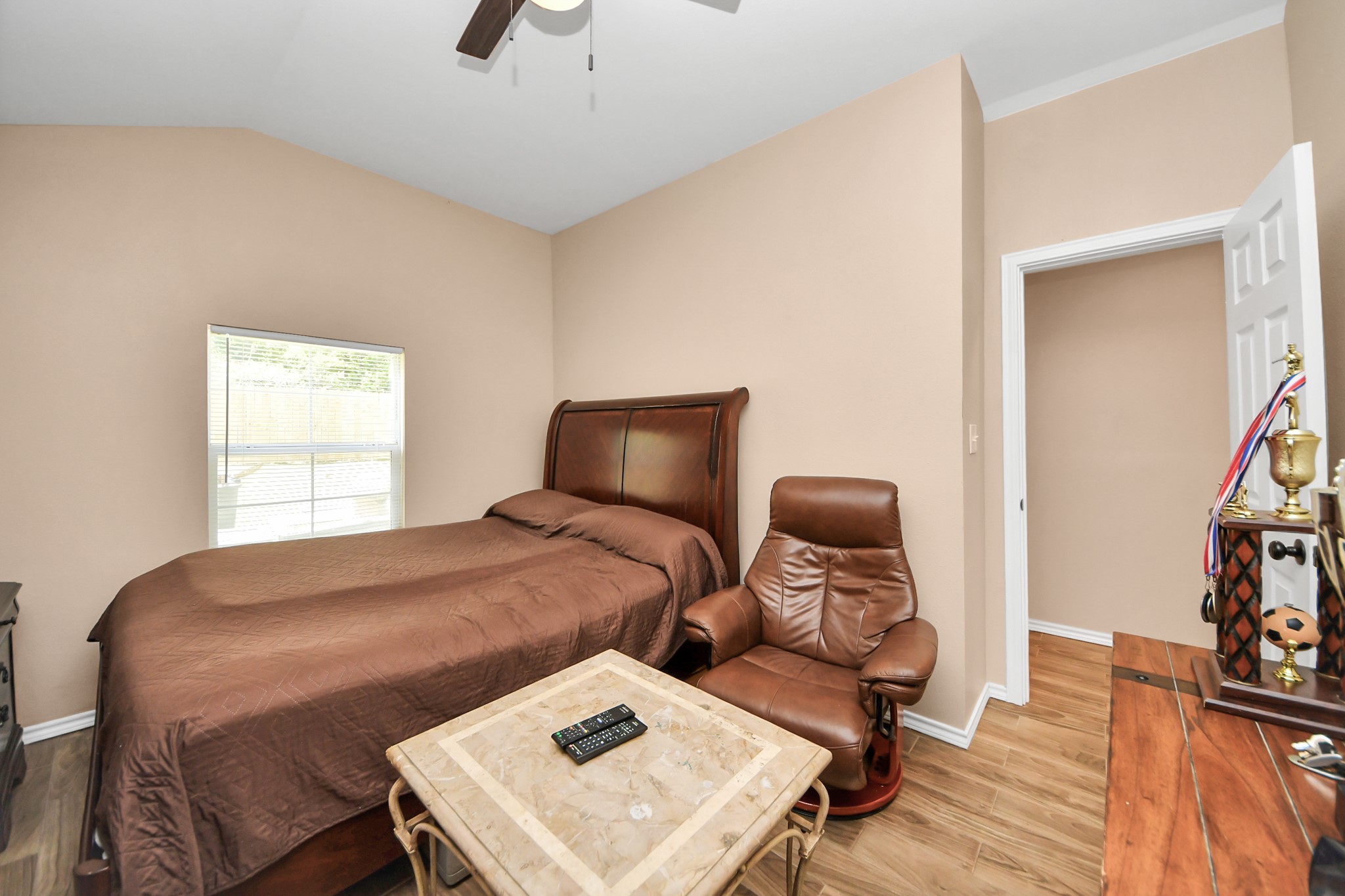 14961 Lamar Road Willis, TX 77378 - Photo 24 of 31 Comfortable secondary bedroom with flexible use options.