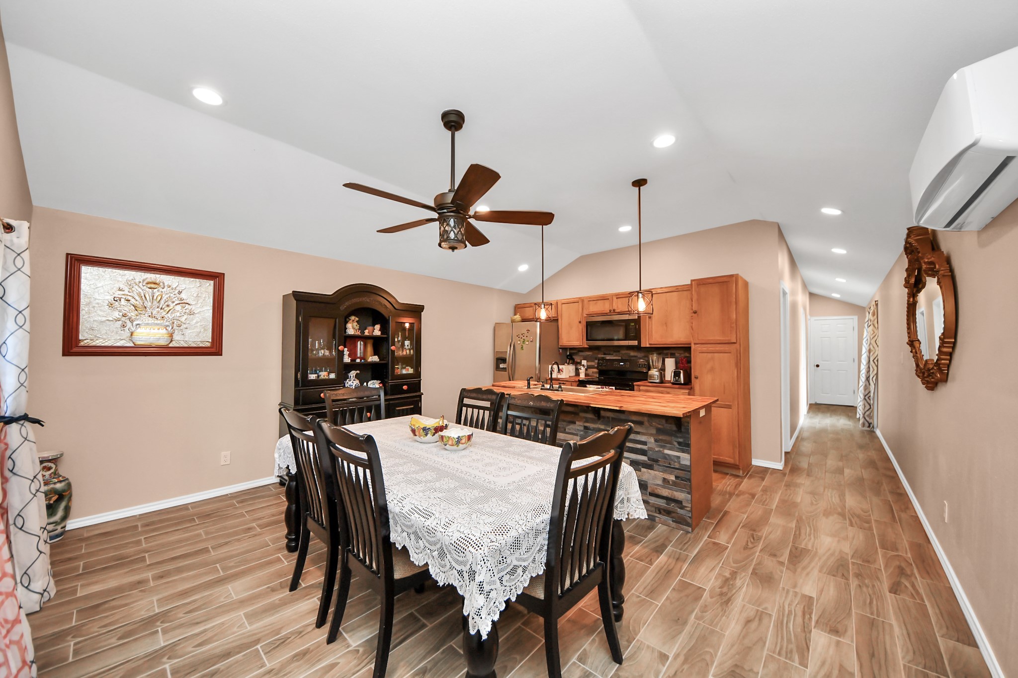 14961 Lamar Road Willis, TX 77378 - Photo 6 of 31 Spacious open layout connecting living, dining, and kitchen areas.