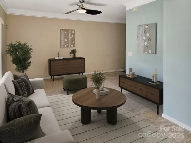 a living room with furniture and a mirror