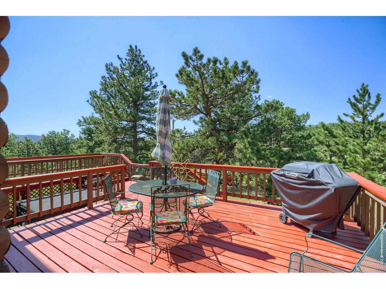 636 Ranch Road Ward, CO 80481 - Photo 3 of 24 Wrap-around decking offers loads of outdoor space to soak in the sunshine and enjoy the fresh mountain air.