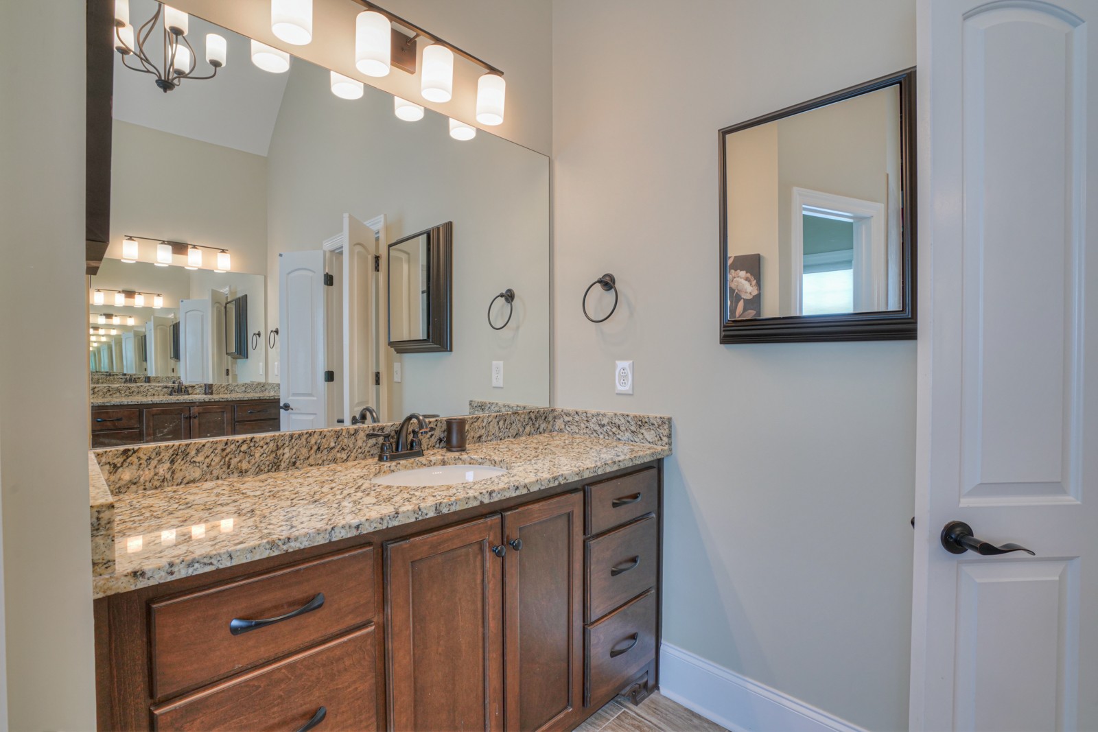 9620 Mona Road Murfreesboro, TN 37129 - Photo 15 of 58 a bathroom with a granite countertop sink a large mirror and a