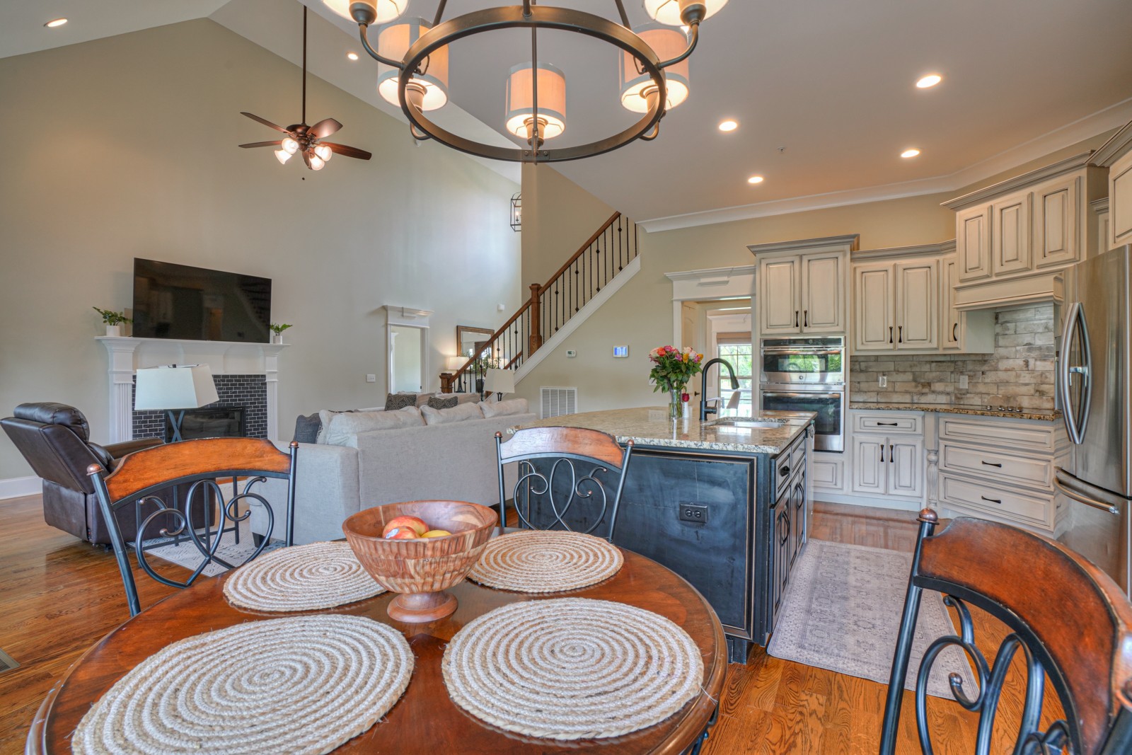 9620 Mona Road Murfreesboro, TN 37129 - Photo 24 of 58 a kitchen with stainless steel appliances kitchen island granite countertop a dining table chairs and a stove