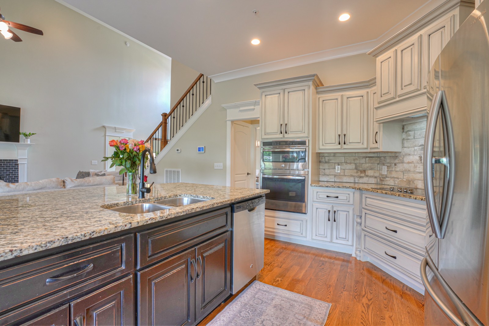 9620 Mona Road Murfreesboro, TN 37129 - Photo 25 of 58 a kitchen with kitchen island granite countertop a sink and dishwasher stove refrigerator with wooden floor