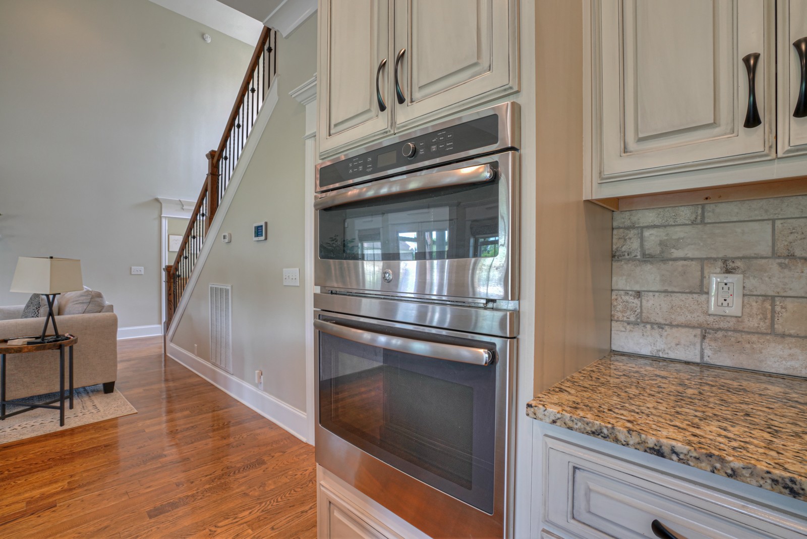 9620 Mona Road Murfreesboro, TN 37129 - Photo 27 of 58 a kitchen with granite countertop a stove and a refrigerator