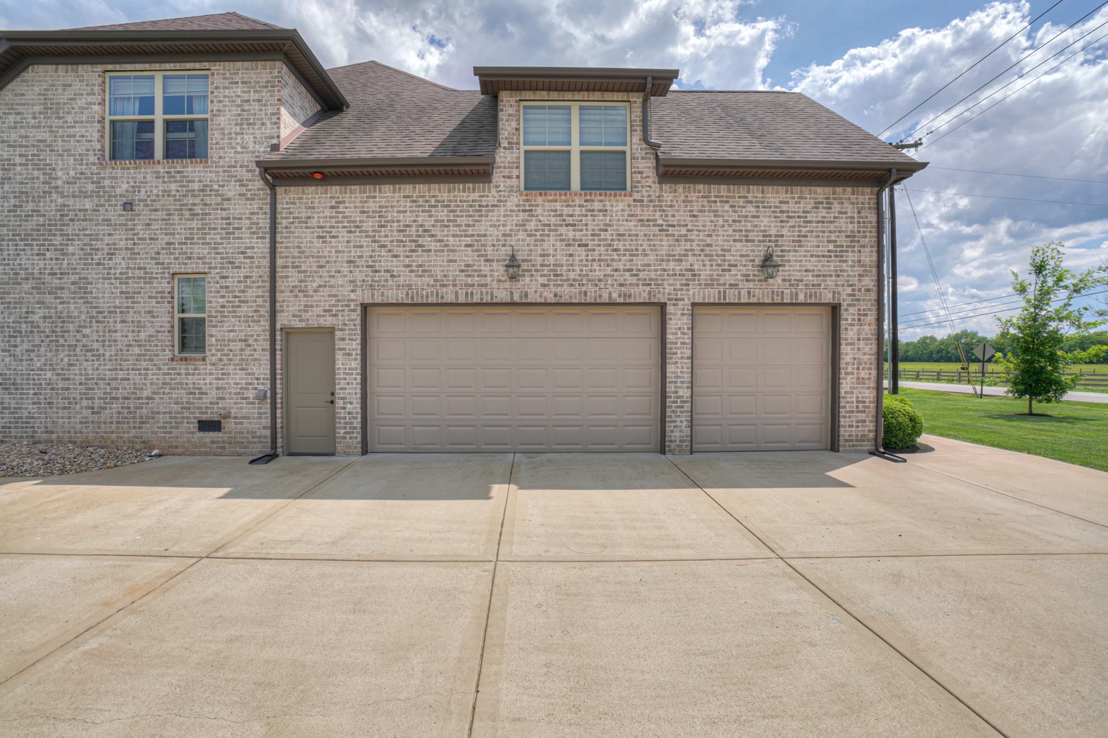 9620 Mona Road Murfreesboro, TN 37129 - Photo 5 of 58 a front view of a house with a garage and yard