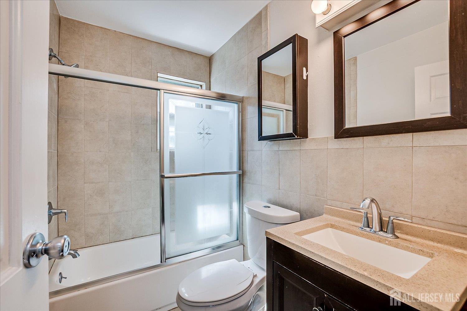 289 Main Street, Unit 4P Spotswood, NJ 08884 - Photo 17 of 22 a bathroom with a sink toilet and shower
