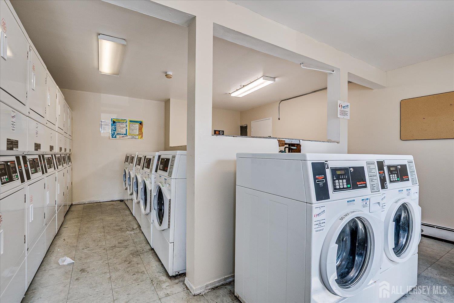 289 Main Street, Unit 4P Spotswood, NJ 08884 - Photo 19 of 22 a utility room with dryer and washer