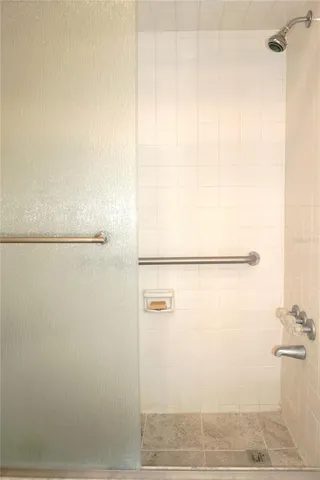 a bedroom with a bed and a table in it