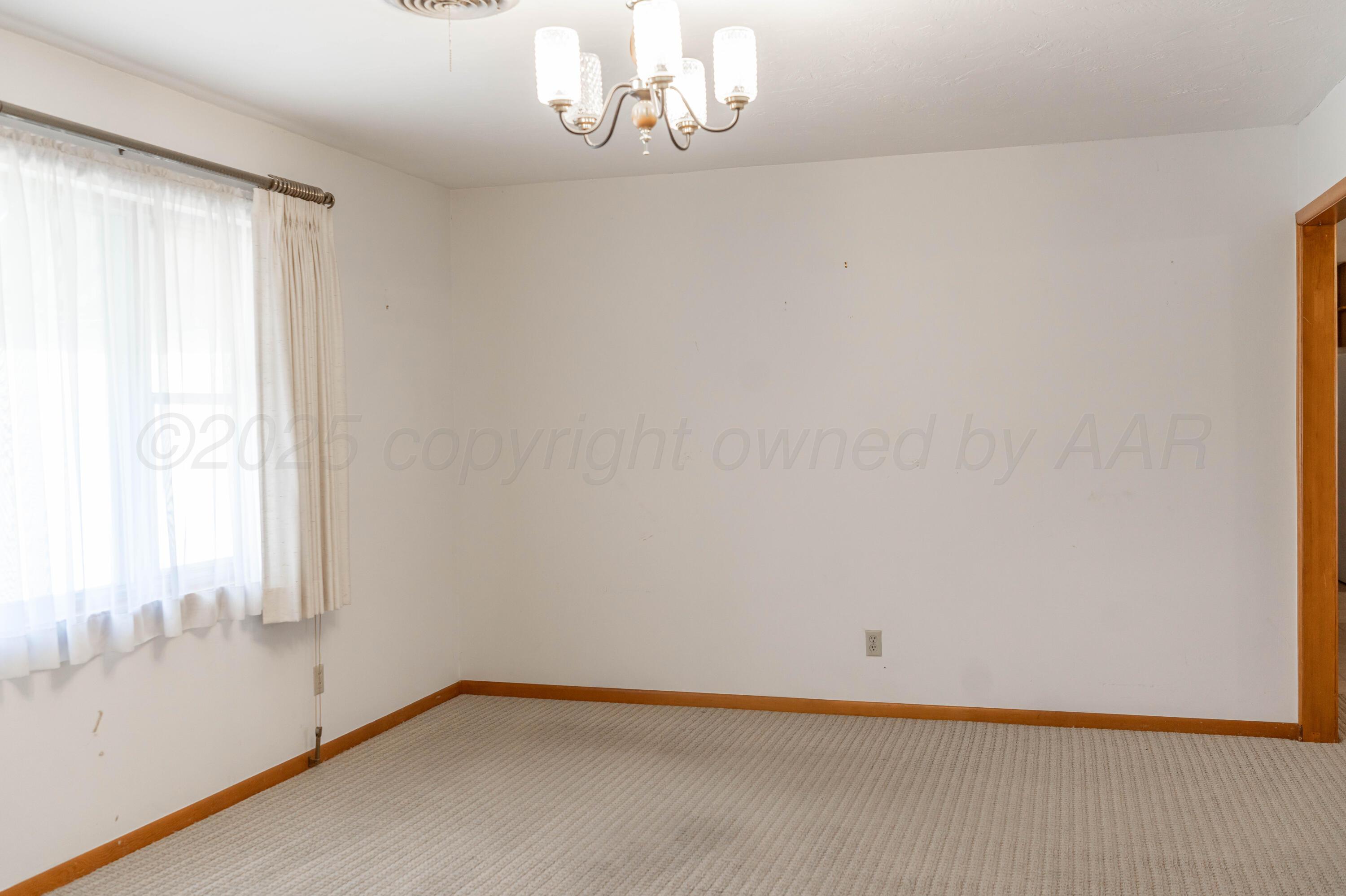 1315 South Canadian Street Wheeler, TX 79096 - Photo 12 of 44 a view of empty room with window