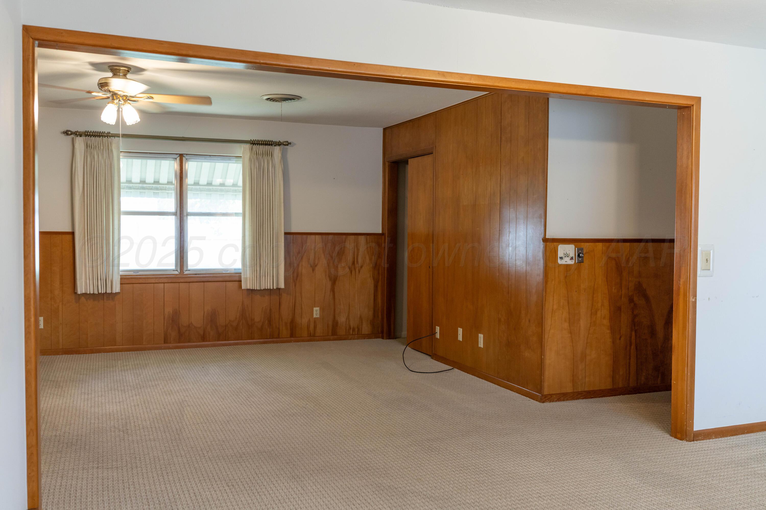 1315 South Canadian Street Wheeler, TX 79096 - Photo 14 of 44 an empty room with windows and closet
