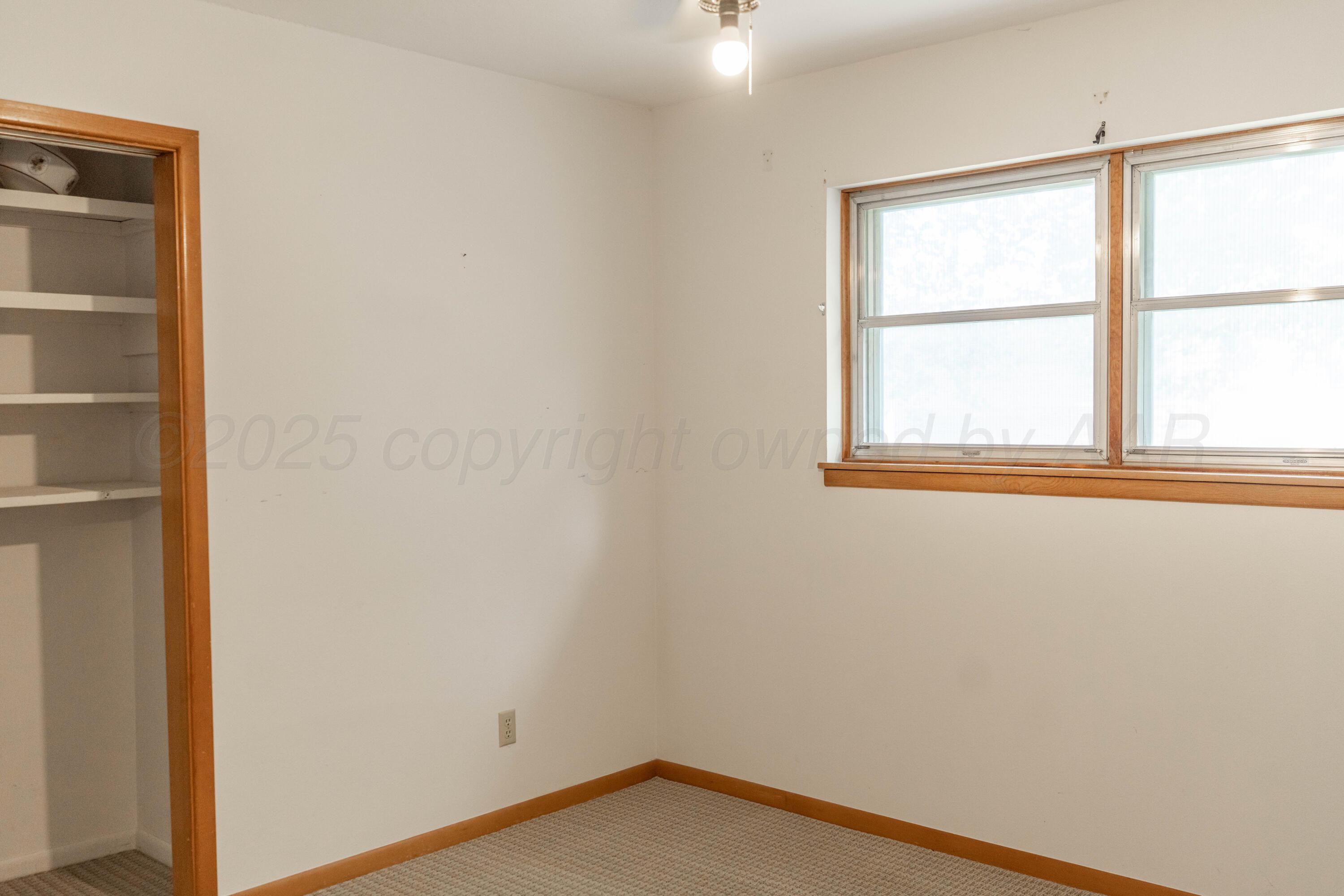 1315 South Canadian Street Wheeler, TX 79096 - Photo 30 of 44 an empty room with a window