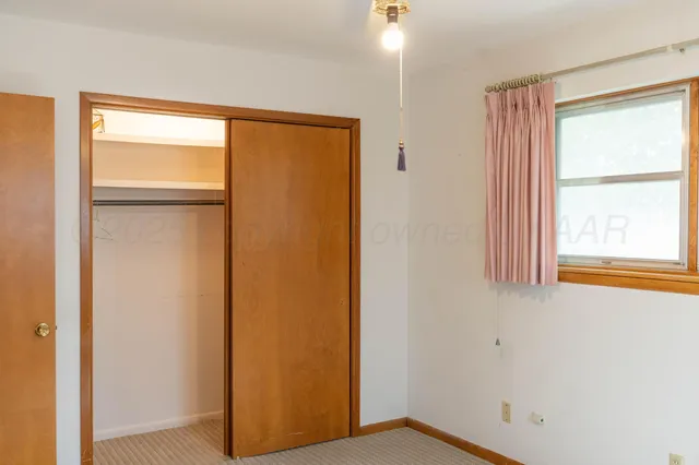 a view of a room with a wardrobe space