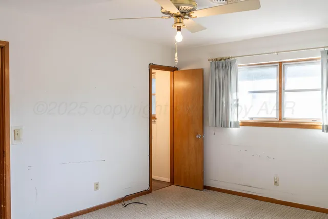 a bathroom with a shower and a toilet