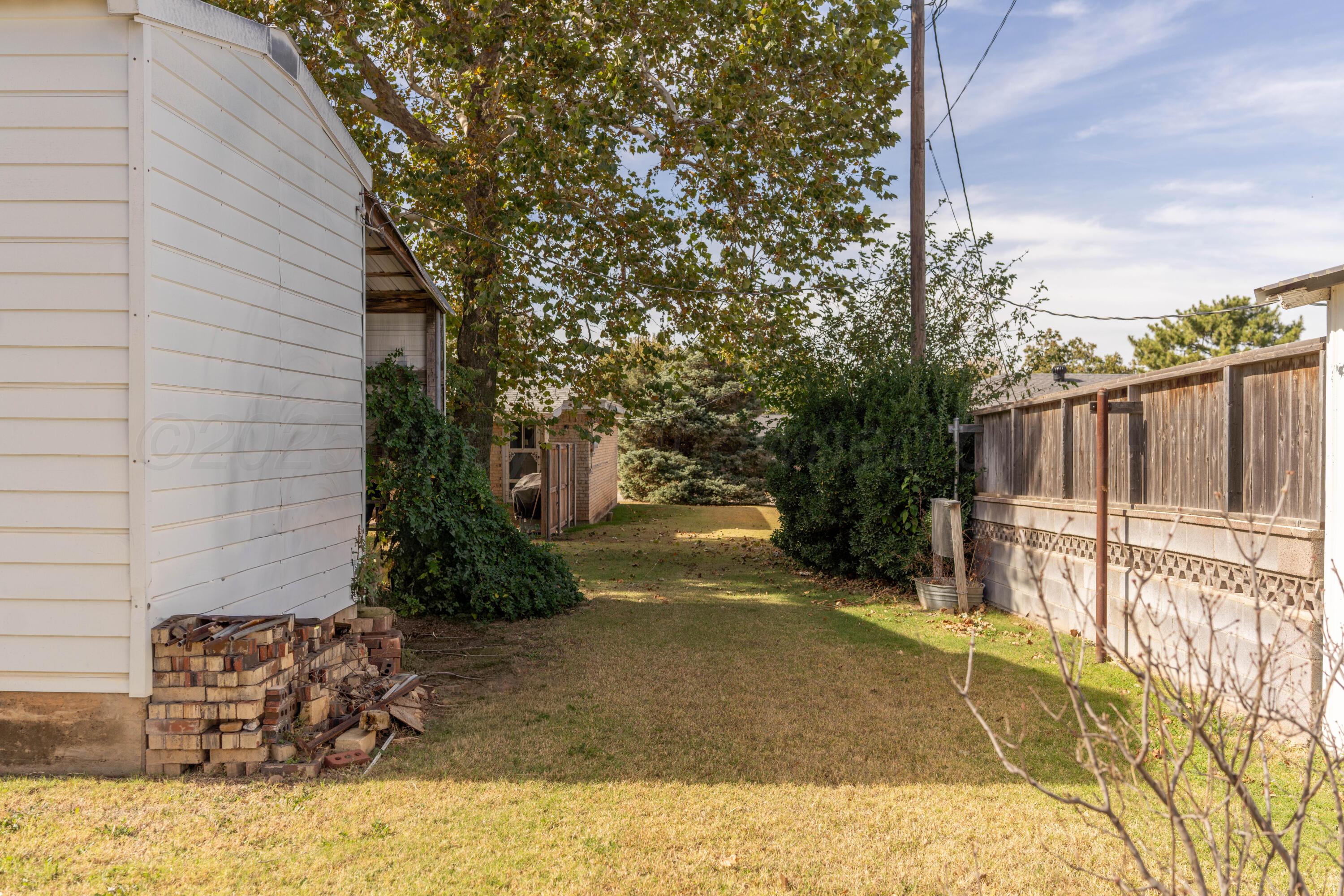 1315 South Canadian Street Wheeler, TX 79096 - Photo 44 of 44 a view of a backyard with pathway