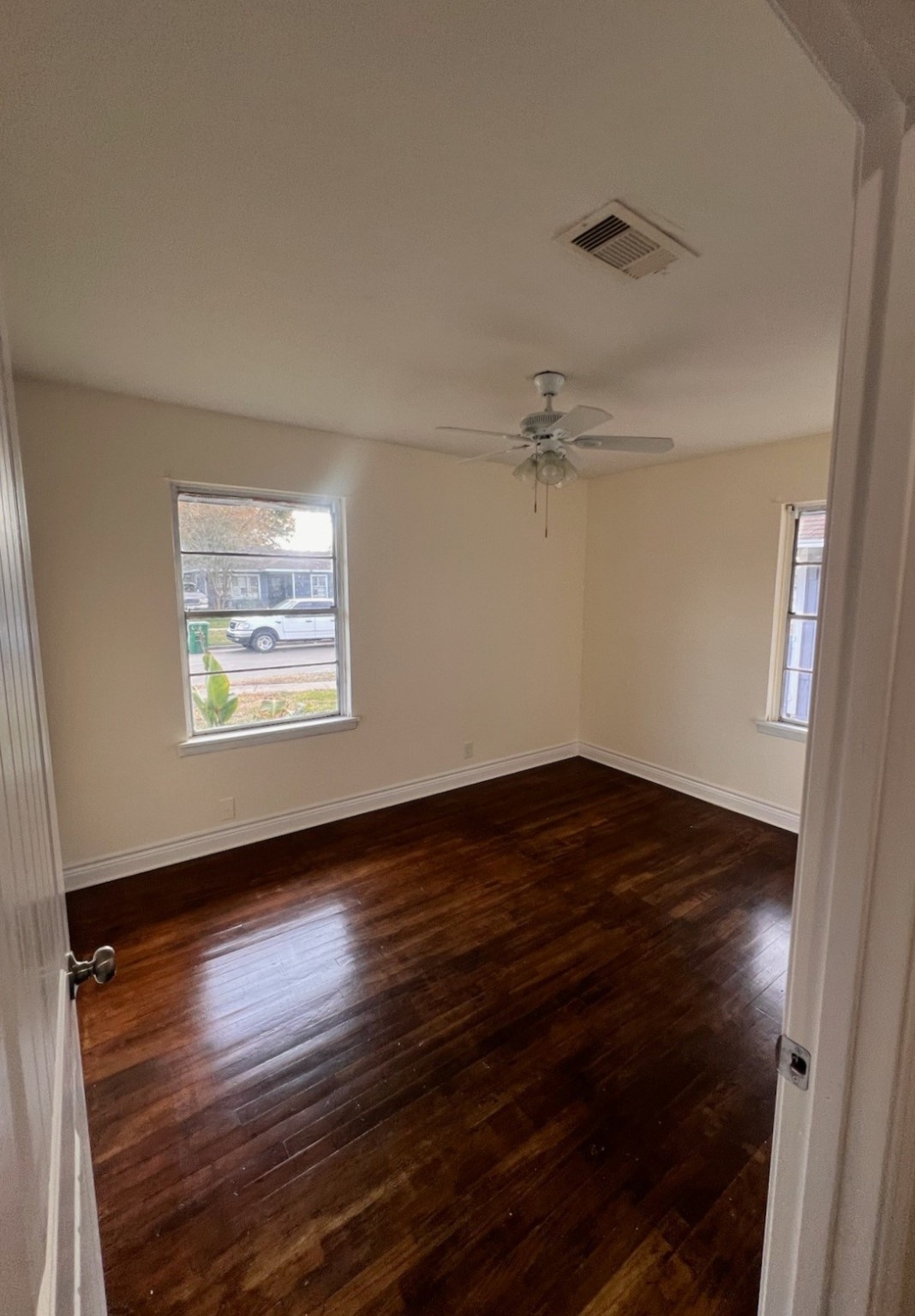 2146 Minnesota Street Houston, TX 77034 - Photo 11 of 22 a view of an empty room with wooden floor and a window