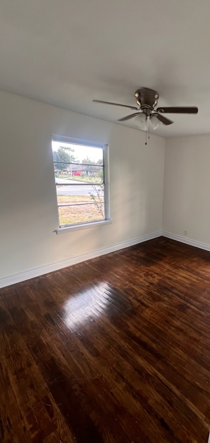 2146 Minnesota Street Houston, TX 77034 - Photo 13 of 22 a view of a room with wooden floor and windows
