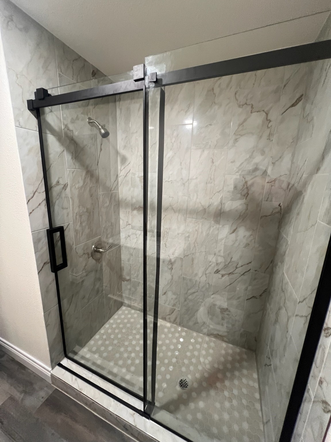 2146 Minnesota Street Houston, TX 77034 - Photo 15 of 22 a bathroom with a glass shower door