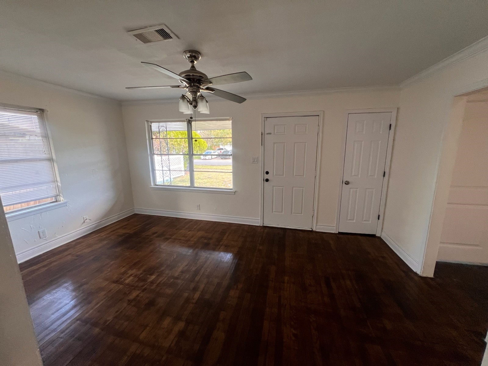 2146 Minnesota Street Houston, TX 77034 - Photo 18 of 22 a view of an empty room with wooden floor and a window
