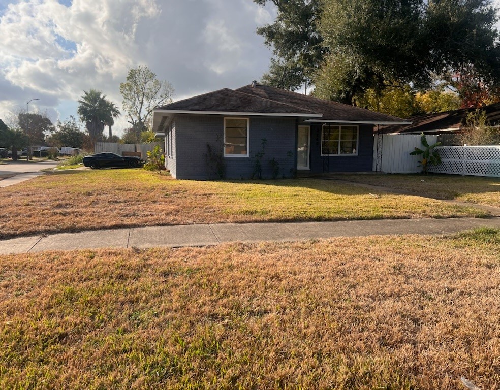 2146 Minnesota Street Houston, TX 77034 - Photo 22 of 22 a front view of a house with a garden