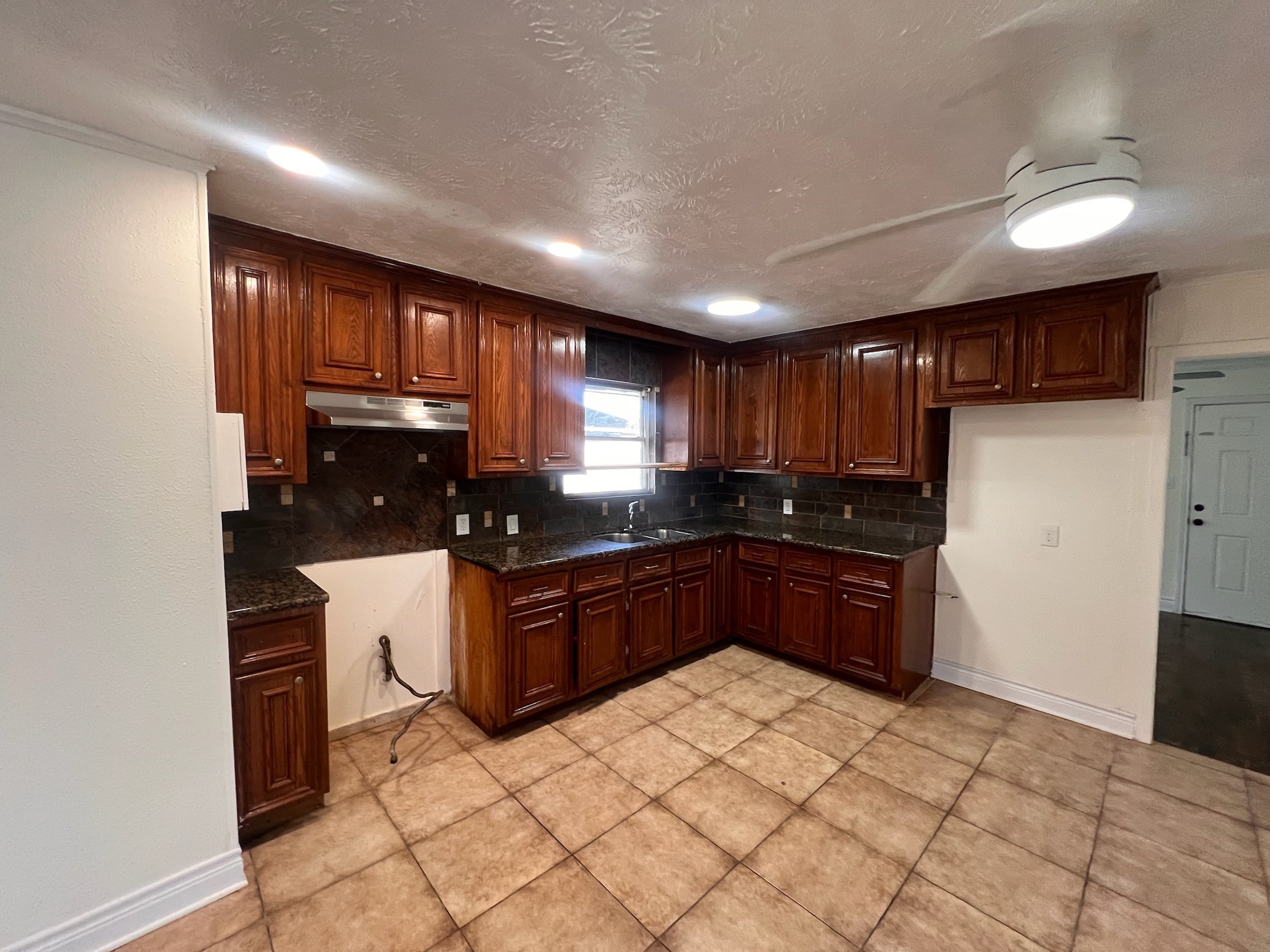 2146 Minnesota Street Houston, TX 77034 - Photo 3 of 22 a kitchen with stainless steel appliances granite countertop a refrigerator and a stove top oven
